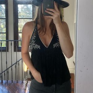 Embroidered tank top, white trim.